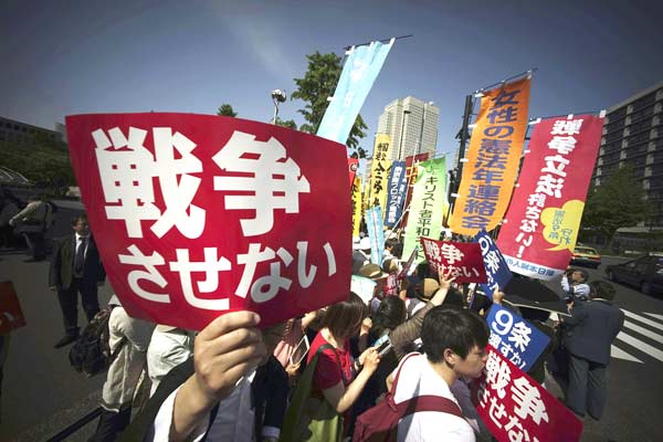 Hundreds of people gather in Tokyo to protest against security bills