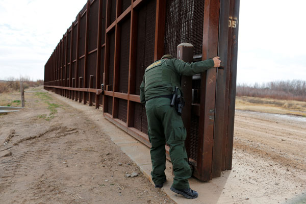 Trump moving forward with border wall, weighs refugee cuts